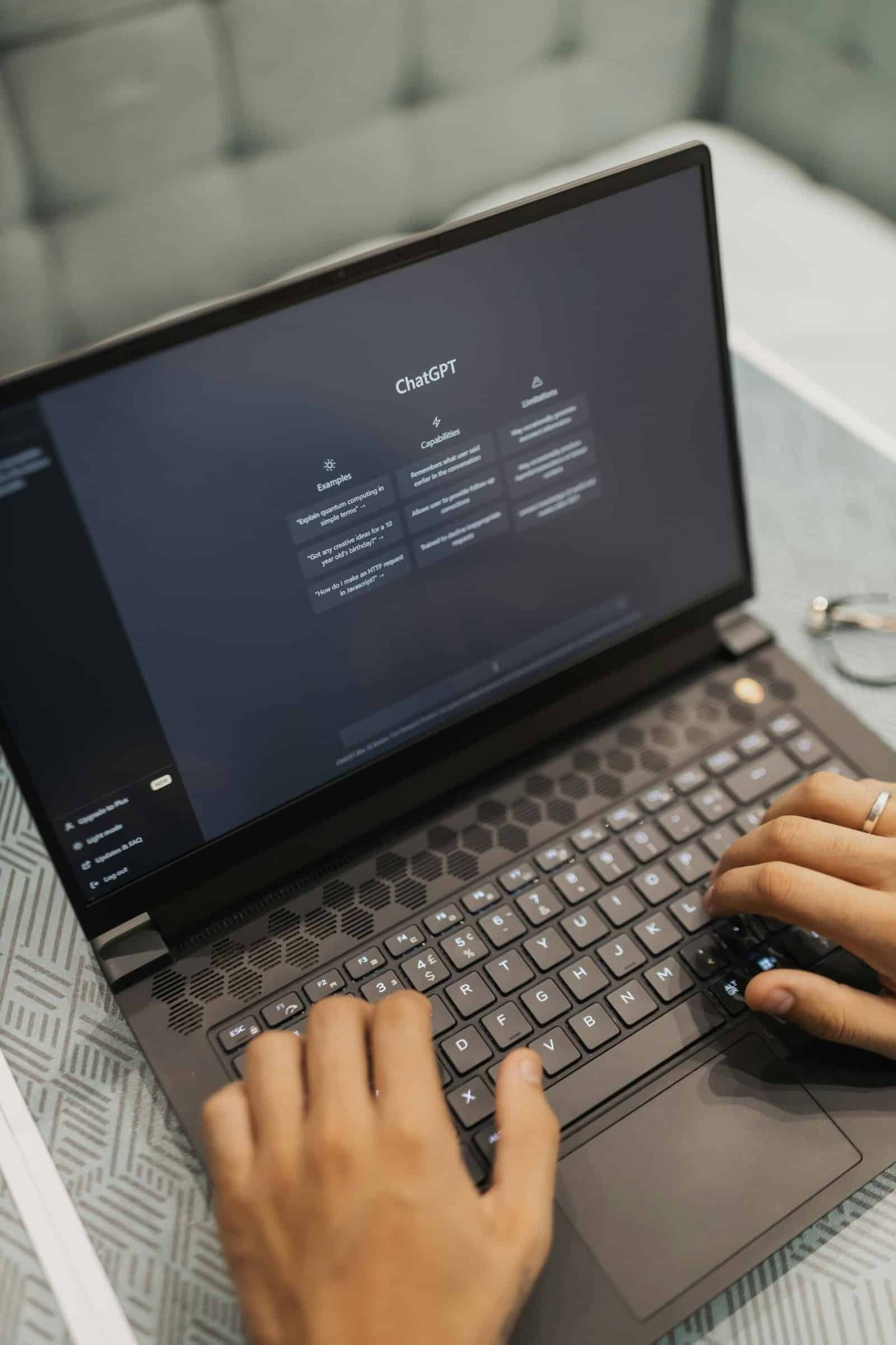 a person typing on a laptop